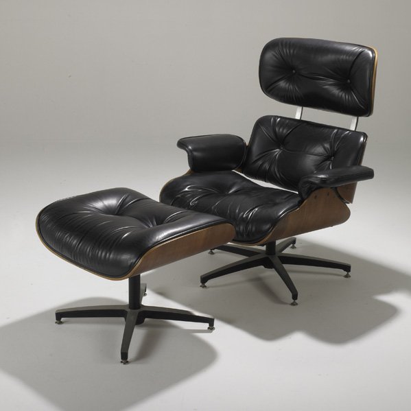 AFTER CHARLES AND RAY EAMES: Lounge chair and ottoman; Walnut, leather and aluminum; Lounge: 39 1/2" x 35" x 30"