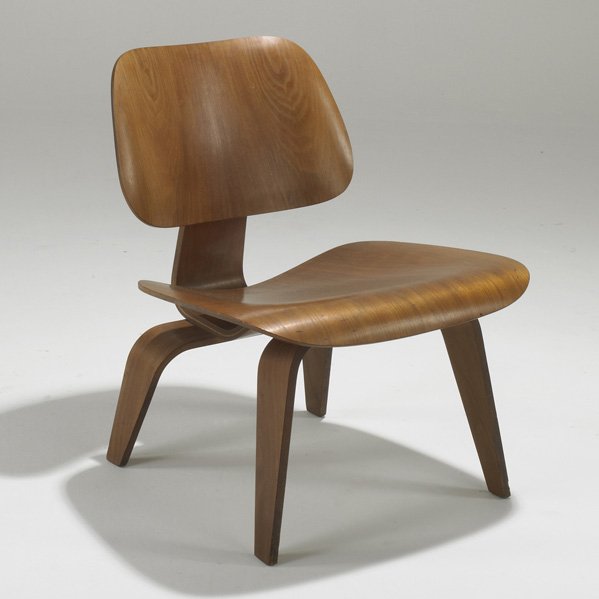 CHARLES AND RAY EAMES; HERMAN MILLER: Lounge chair (LCW), USA, 1952; Walnut plywood and rubber; Stamped; 26 1/2" x 22" x 23"