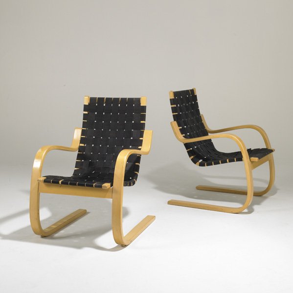 ALVAR AALTO; ARTEK: Pair of lounge chairs, Finland, 1980s; Birch and canvas webbing; ICF label; Each: 34" x 24" x 29"