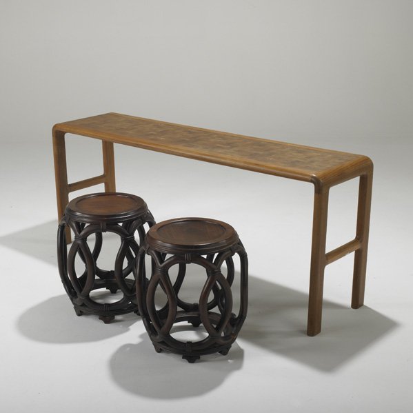 TRANEKAER; JOHN STUART: Console table and pair of stools, Denmark, 1970s; Teak and rosewood; Brass label to console; Consol: 25" x 60" x 16" and each stool: 18" x 15" dia.