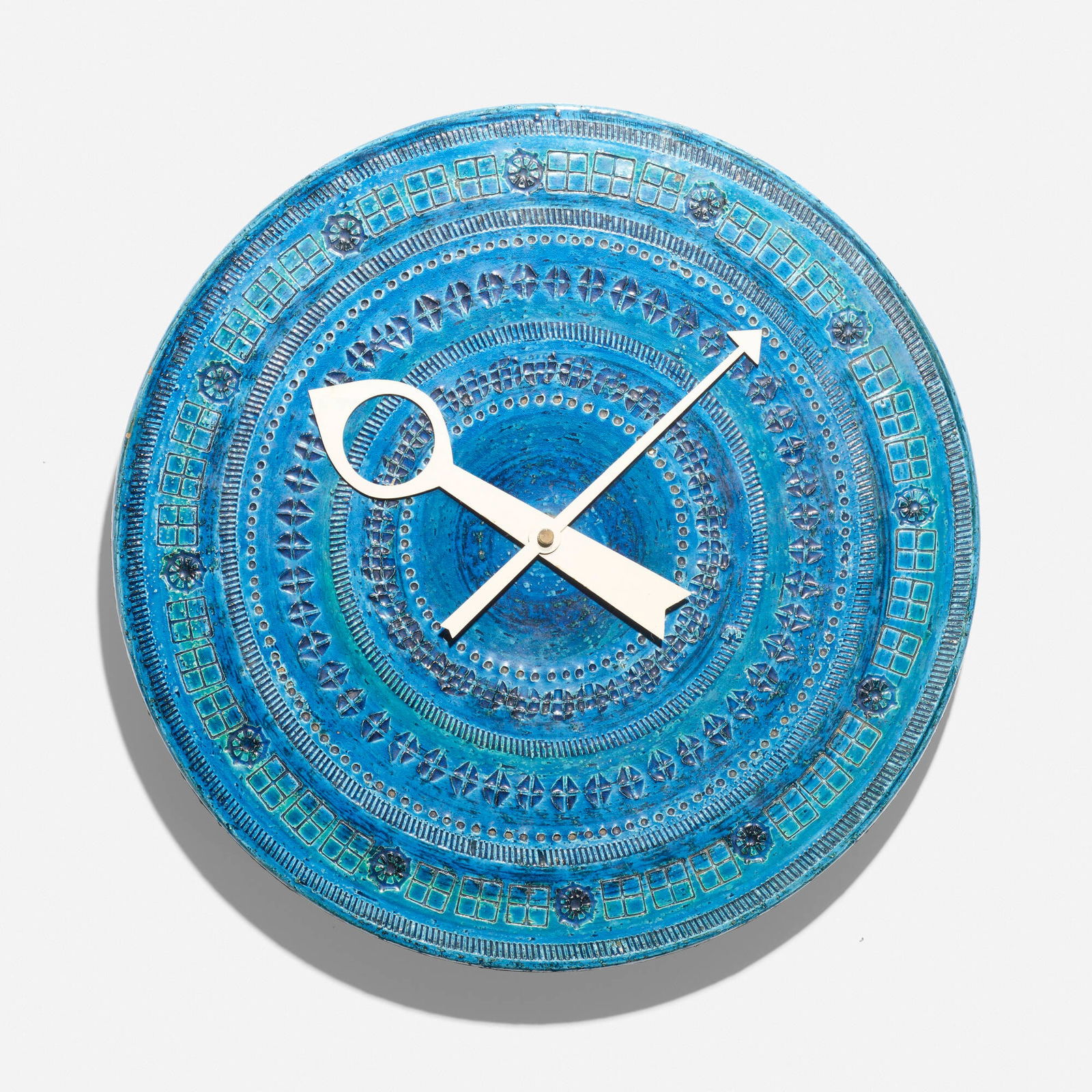 Howard Miller Clock Co. and Bitossi, Rimini Blu wall clock, model 7552: Howard Miller Clock Co. and Bitossi Rimini Blu wall clock, model 7552 BitossiUSA/Italy, c. 1970glazed stoneware, enameled aluminum 2.75 d x 14.125 dia in (7 x 36 cm) This clock was made