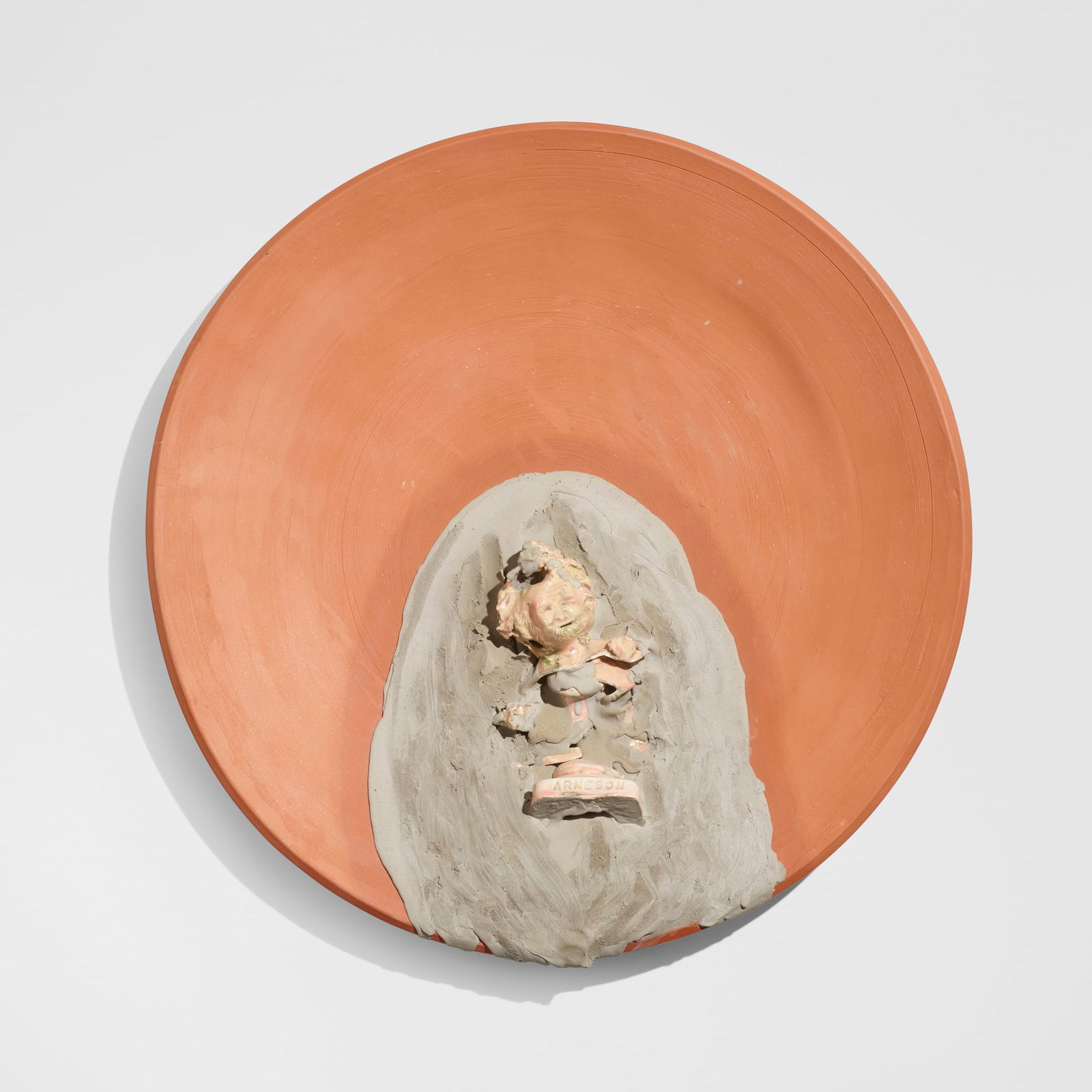 Robert Arneson, Messed With!: Robert Arneson Messed With! USA, 1992glazed earthenware, bisque earthenware 22.5 h x 22 w x 2.75 d in (57 x 56 x 7 cm) For the present work, the artist added a broken Self-Portrait Trophy B