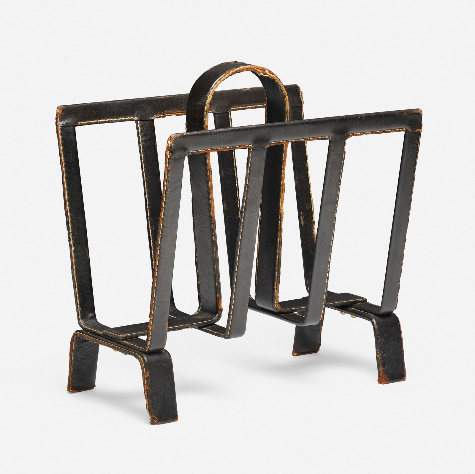 In the manner of Jacques Adnet, Magazine rack (1 of 4)