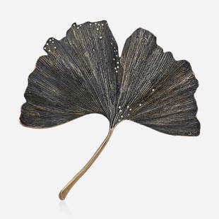 John Iversen, Sterling silver and diamond gingko brooch: John Iversen Sterling silver and diamond gingko brooch Cast from a fallen gingko leaf, enhanced by round brilliant-cut diamonds; 2010s Sterling silver Signed Iversen 4 x 4 in; Gross weight 28.0 dwts