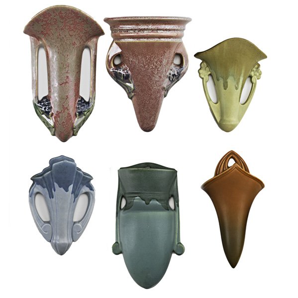 ROSEVILLE Six wallpockets: ROSEVILLE; Six wallpockets: Three Carnelian I in Green, Yellow, and Blue, Two Pink Tuscany and Brown Florane; Most marked; Tallest 9"