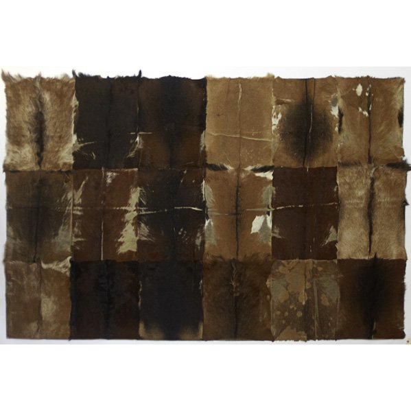 Hide rugs, Moroccan blanket curtains: Four lined and hand-stitched patchwork hide rugs, together with three pairs of Moroccan blanket curtains; Unmarked; Each rug about 9' x 6' 5", each curtain approx. 8' x 5 1/2'
