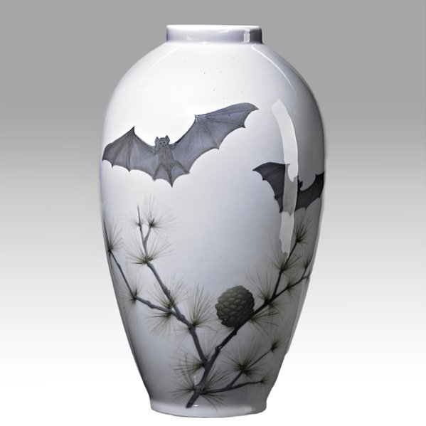 ROYAL COPENHAGEN Porcelain vase with bats: ROYAL COPENHAGEN; Porcelain vase with bats and pine boughs, Denmark, 1889-1922; Green circular stamp, three waves, 94/475/47D; 8 3/4" x 5"