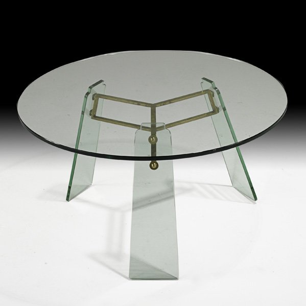 PIETRO CHIESA; FONTANA ARTE Glass coffee table: PIETRO CHIESA; FONTANA ARTE; Coffee table, Italy, 1940s; Glass, brass; Unmarked; 18" x 32" dia.