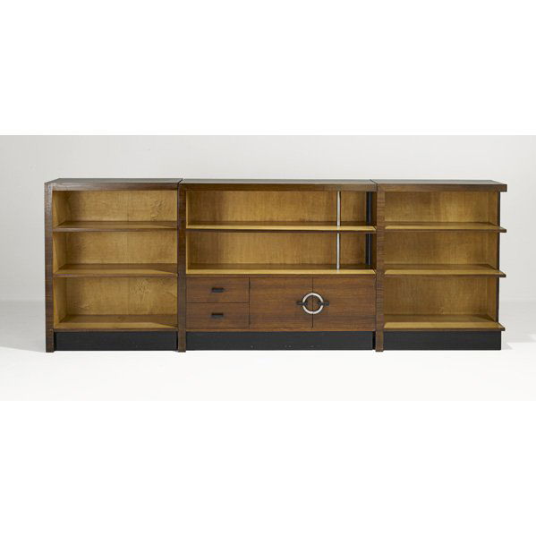 GILBERT ROHDE Three bookcases: GILBERT ROHDE; HERMAN MILLER; Three bookcases, Zeeland, MI, 1930s; Paldao wood, birch, ebonized wood, brushed metal; Foil labels; Smaller: 32" x 41" x 15", larger: 41" x 48" x 15"