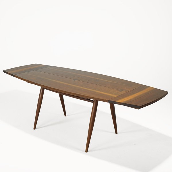 GEORGE NAKASHIMA Early Turned Leg dining table: GEORGE NAKASHIMA; NAKASHIMA STUDIOS; Turned Leg dining table, New Hope, PA, 1958; Walnut, rosewood; Signed with client's name; 29" x 60" x 36", two leaves, 14" Provenance available: copy of original i