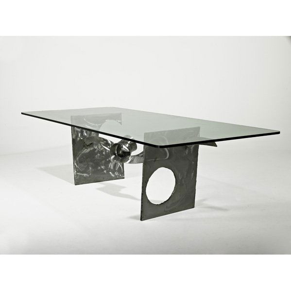 SILAS SEANDEL Dining table: SILAS SEANDEL; Dining table, New York, 1976; Torch-cut, twisted, and brushed steel, glass; Signed and dated; 30" x 112" x 48" Provenance: Forbes Management Co.