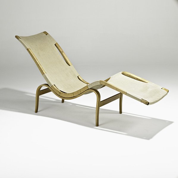 BRUNO MATHSSON Pernilla chaise: BRUNO MATHSSON; KARL MATHSSON; Pernilla chaise, Sweden, 1936; Bent birch, laminated beech, canvas; Manufacturer's labels, stamped; 32 3/4" x 63 1/2" x 19 3/4" Note: 1936 was the first year of producti