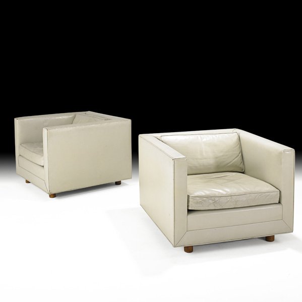 WARD BENNETT Pr. tuxedo club chairs: WARD BENNETT; BRICKEL; Pair of tuxedo club chairs, New York, 1960s; Leather, walnut; Manufacturer's labels; 25" x 33" sq.