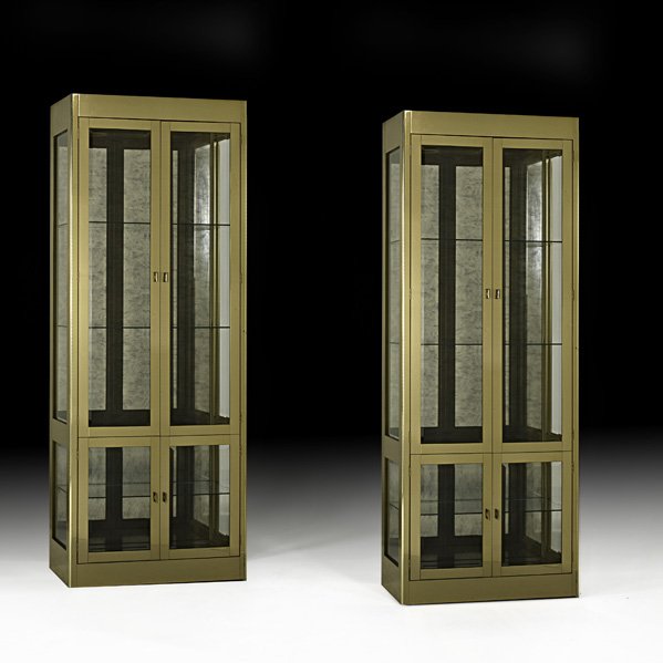 MASTERCRAFT Pair of illuminated vitrines: MASTERCRAFT; Pair of illuminated vitrines, USA, 1990s; Brass, antiqued mirror, glass, enameled wood; Brass labels; 84" x 32" x 16"