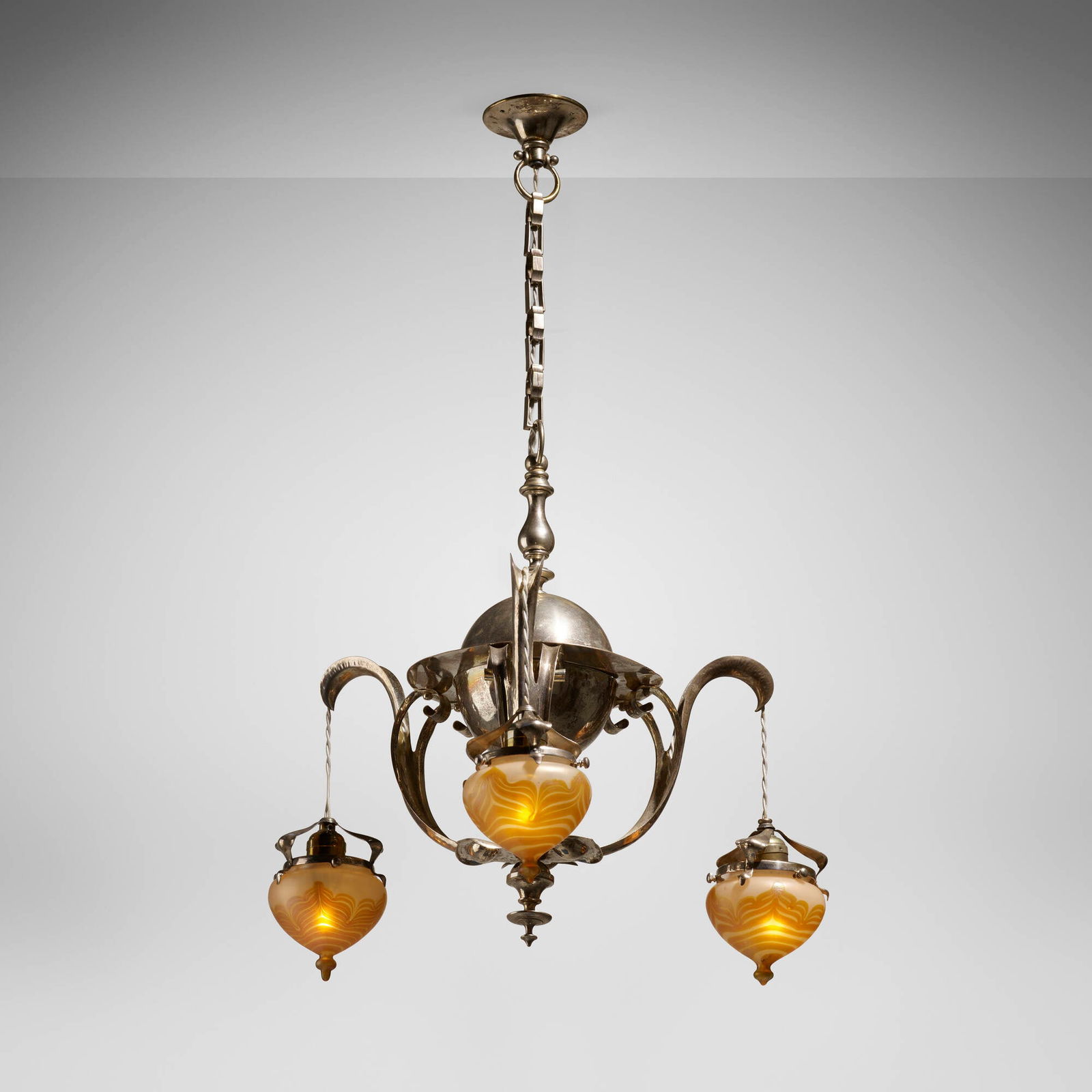 Austrian, Chandelier with Loetz shades: Austrian Chandelier with Loetz shades c. 1900silver-plated metal, hand-blown glass 20.5 h x 20 dia in (52 x 51 cm) Chandelier features three Phanomen shades (Gre 829). Literatur
