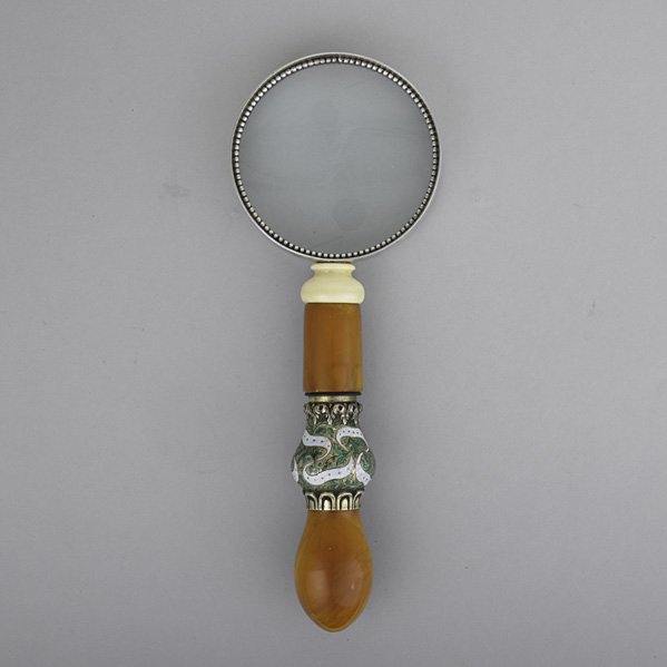 ENAMELED SILVER AMBER, IVORY MAGNIFYING GLASS: Designed by Vincent Simone, NYC, 1970's. Incorporates ornamental elements from a hookah. 10". International bids and bids issuing from the State of California may be subject to laws that forbid the ex