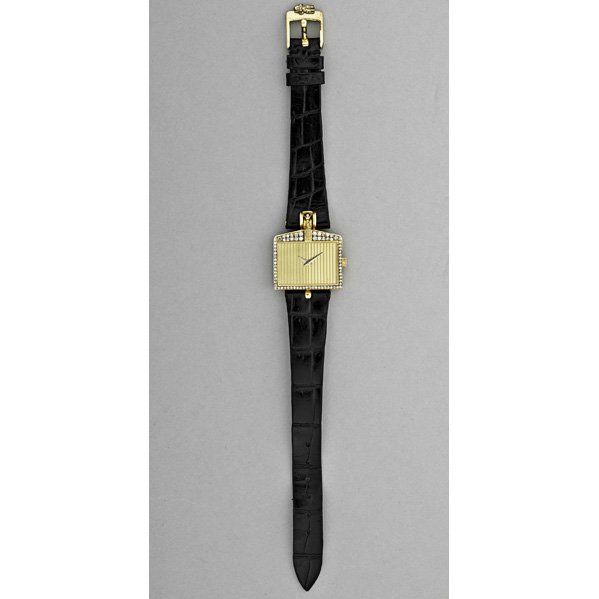 CORUM "ROLLS ROYCE" GOLD DIAMOND LADIES WATCH: Ribbed face mimics the radiator grill of a Rolls Royce with Spirit of Ecstasy mascot and diamond trim in 18k gold, 1980's. #47595, 361238, Corum black crocodile strap. In original box. 7 jeweled quart