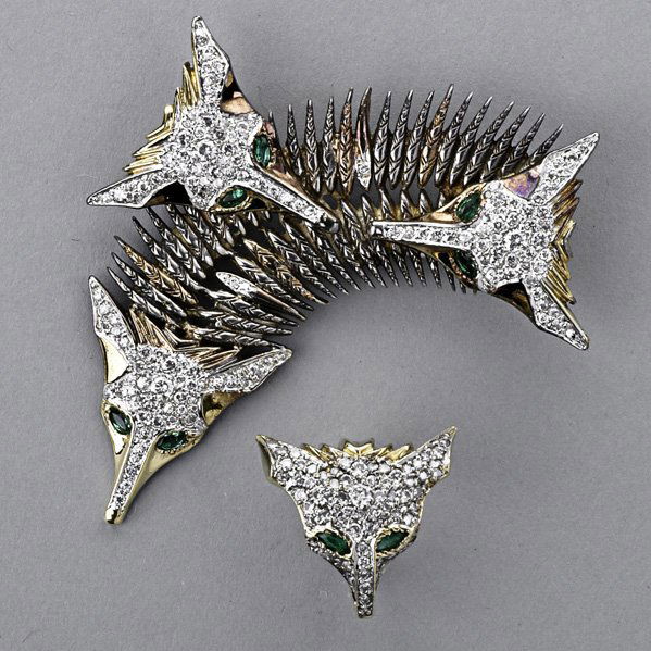 ERTE "FOX" DIAMOND BROOCH AND RING, ca. 1980: 18k yg. and silver designed as an "all season fox shawl" with diamond pave and emerald eyes. Brooch, state I, #7/75, 2 3/4"; ring, state III, #181/250, size 3 3/4. Circle Fine Arts. 20.4 dwt. (31.8 gs