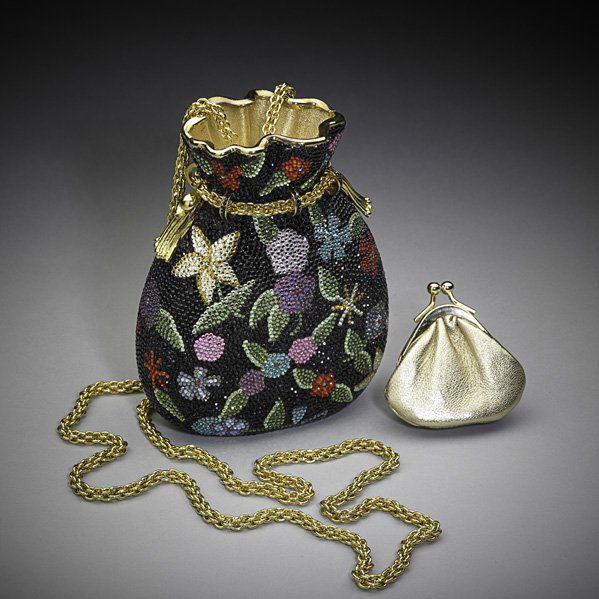 JUDITH LEIBER FLORAL PURSE MINAUDIERE: Polychrome crystal floral on black ground in the shape of a miser's purse, gold leather interior, gilt drop-chain, with change purse and dust bag, 5 1/2"