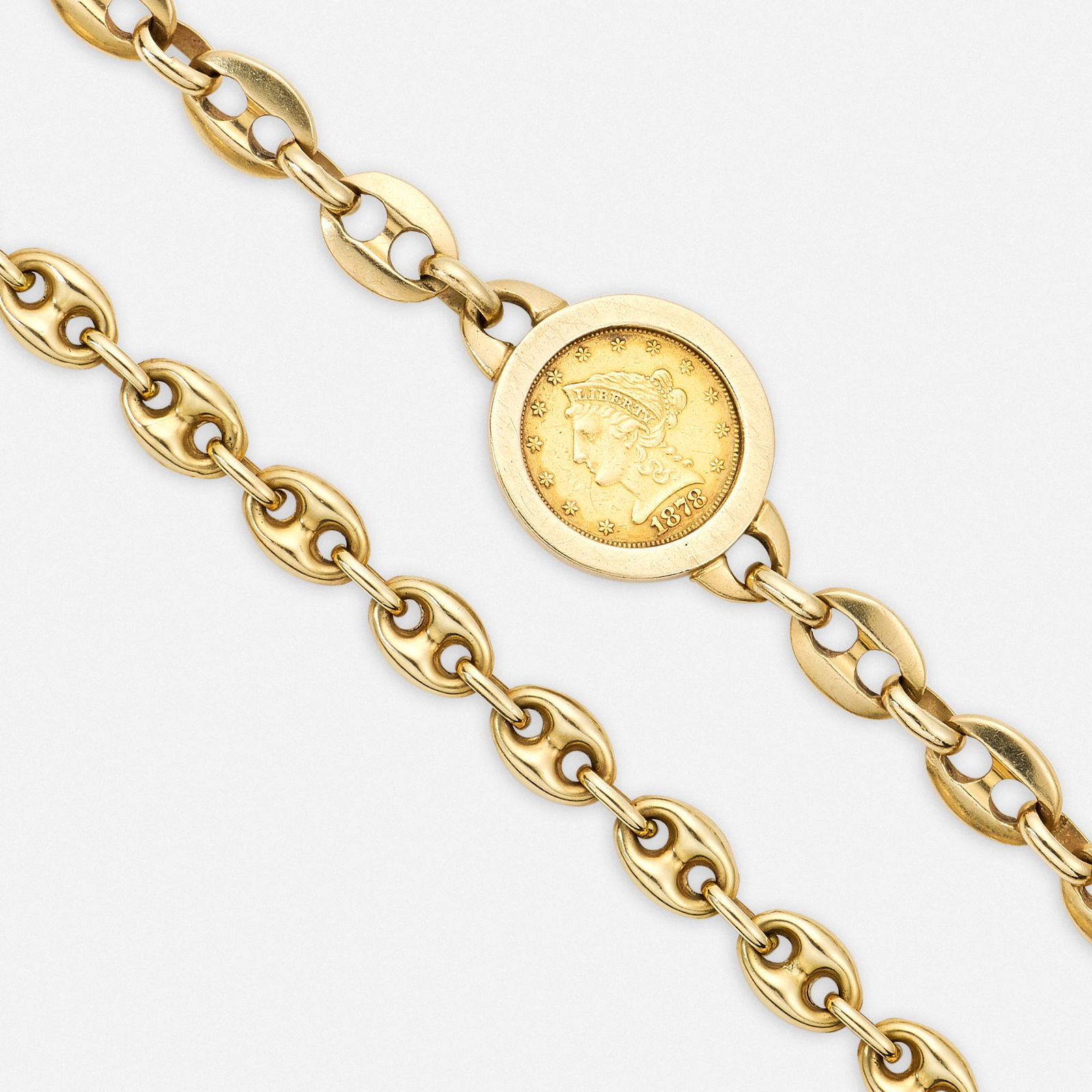 Two gold bracelets: Two gold bracelets Comprising two mariner link bracelets, one further set with a U.S. 1878 Liberty $2.50 gold coin 14k yellow gold 8 x 0.75 in and 7.75 x 0.25 in; Gross weight 25.0 dwts Provenance: Pr