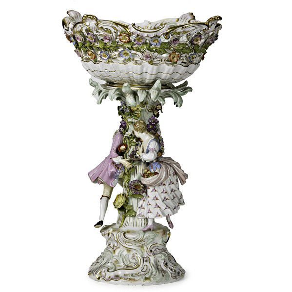 MEISSEN PORCELAIN: Porcelain figural footed compote with applied floral decoration, 19th/20th c.; Crossed swords mark; 19" x 14" x 11 1/2"