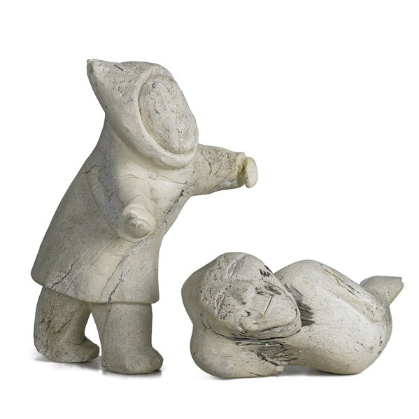 INUIT ESKIMO CARVED WHALEBONE SCULPTURES: Reclining sea spirit and standing Eskimo figure, 20th c.; Larger: 18"