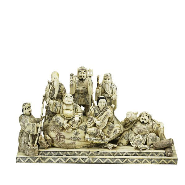 JAPANESE BONE OR IVORY: Seven figures mounted on stepped base, early 20th c.: lute player, hotei, fishmonger, guardian, scholar and two elders; 12" x 20 3/8" x 7 3/8"