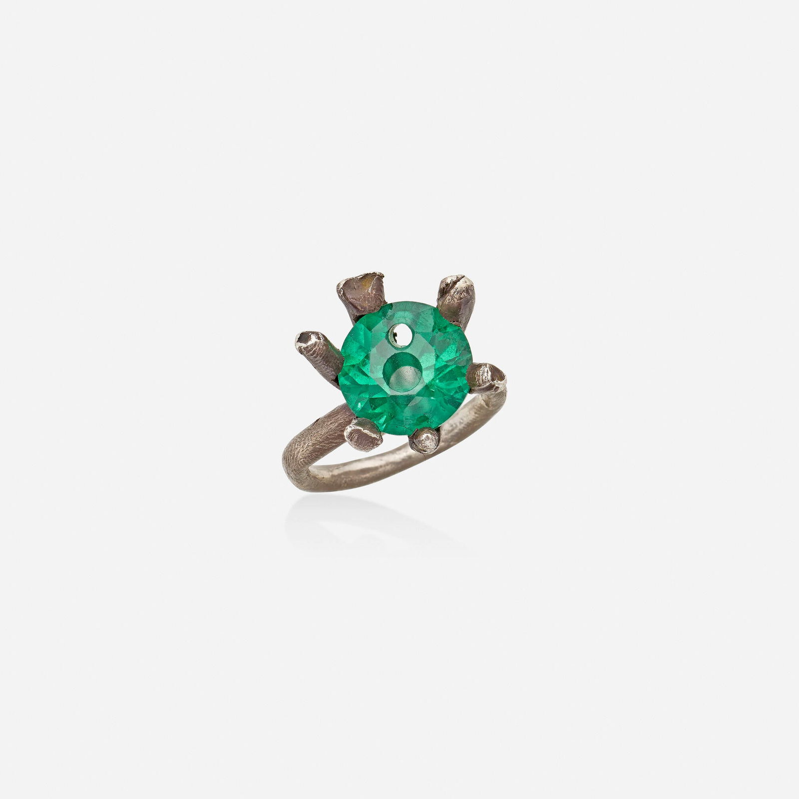 Karl Fritsch, Silver and synthetic spinel ring: Karl Fritsch Silver and synthetic spinel ring Set with a circular-cut green synthetic spinel with two drilled holes; 2008 Silver Signed KF Ring size 7.50; Gross weight 6.4 dwts