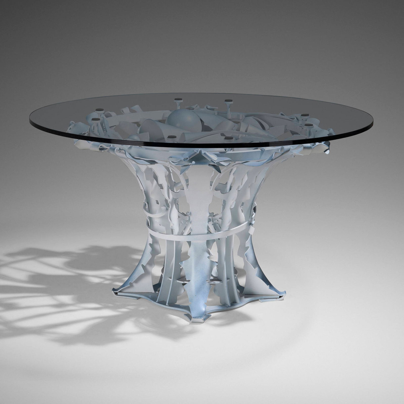 Albert Paley, Meridian table: Albert Paley Meridian table USA, 2015forged and fabricated steel with a polychromed finish, glass 28.75 h x 50 dia in (73 x 127 cm) Impressed signature and date to base 'Albert Paley 2015'. Th