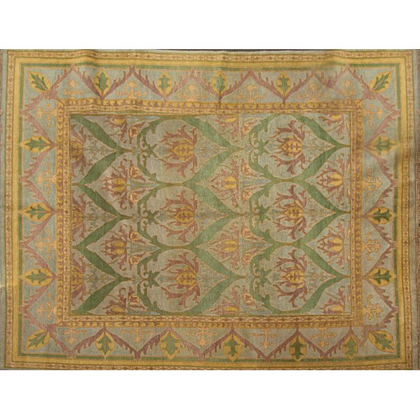 STYLE OF WILLIAM MORRIS: Contemporary room-size rug in green, mustard and purple floral pattern on French blue field; Unsigned; 8' 9" x 11' 9"