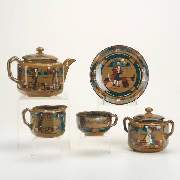 BUFFALO POTTERY: Deldare Ware Tea set: "Village Life in Ye Olden Times" Teapot, "Scenes of Village Life in Ye Olden Times" creamer and sugar, and "Ye Olden Days" cup and saucer; Marked; Teapot: 5"