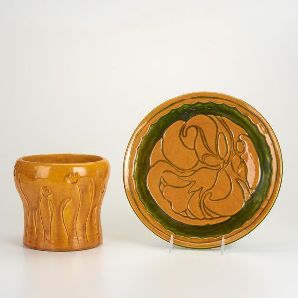UNIVERSITY OF OKLAHOMA; TEXAS STATE COLLEGE: Two glazed pieces: charger with carved flower by Julia E. Hildt, University of Oklahoma 1931, and planter with full-length carved florals by Dorothy Burtscher, Texas State College 1943; Both signed an