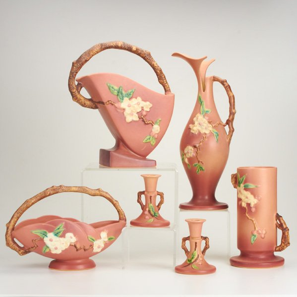 ROSEVILLE: Pink Apple Blossom, six pieces: ewer, two baskets, vase and pair of candlesticks; Marked; Tallest: 15 1/2"