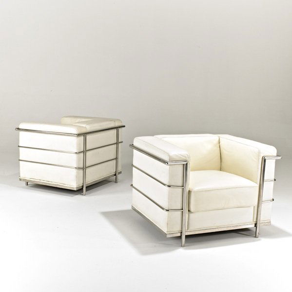 STYLE OF LE CORBUSIER: Pair of club chairs, ca 2000; Chromed steel and leather; Unmarked; Each: 26 1/2" x 35 1/2" x 29"