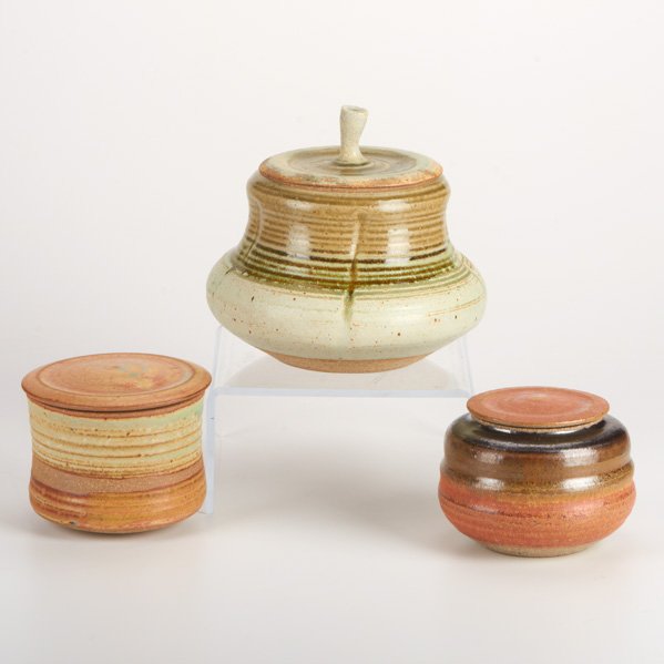 KAREN KARNES: Three lidded stoneware vessels; Impressed KK monogram; Largest: 7 1/4" x 7 3/4"