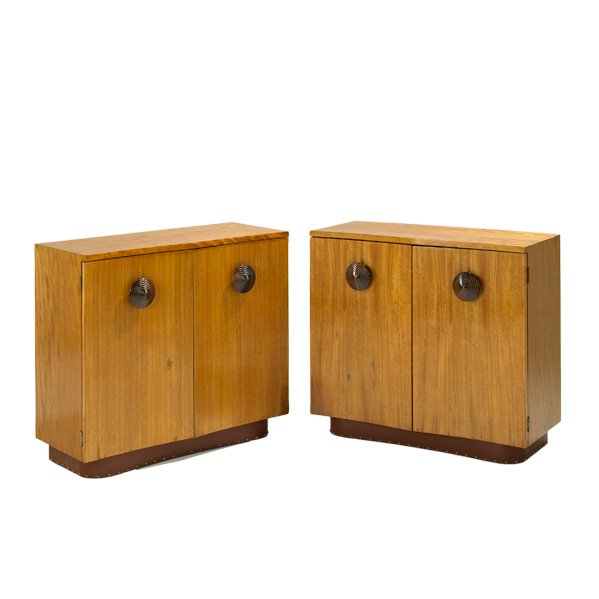 GILBERT ROHDE; HERMAN MILLER: Pair of two-door cabinets, Zeeland, Michigan, ca. 1940; Paldao, vinyl and brass;Stenciled mark 4910; Each: 30" x 33" x 15"