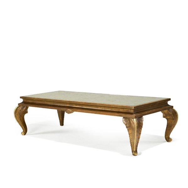 MAISON JANSEN (Attr.): Coffee table, France, 1940s; Carved, gilt wood and antiqued and mirrored glass; Exporter's paper label; 15" x 51 1/2" x 25"