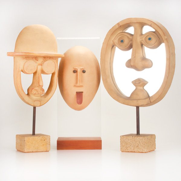 DAVID GIL; BENNINGTON POTTERS: Collection of three stoneware face sculptures, Bennington, VT, 1990s; All signed; Largest: 21 3/4" x 12 3/4" x 4 1/2" sq.