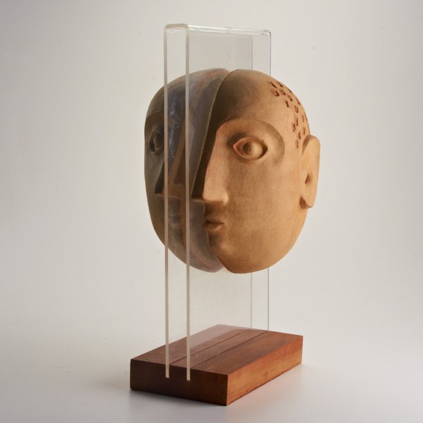 DAVID GIL; BENNINGTON POTTERS: Stoneware face sculpture, on acrylic and wood base, Bennington, VT, 1990s; Unmarked; 19" x 10" x 6"