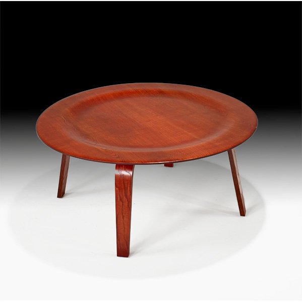 CHARLES AND RAY EAMES; HERMAN MILLER: CTW-3, Zeeland, MI, 1950s; Aniline-dyed ash plywood; Unmarked; 15 1/2" x 34" dia.