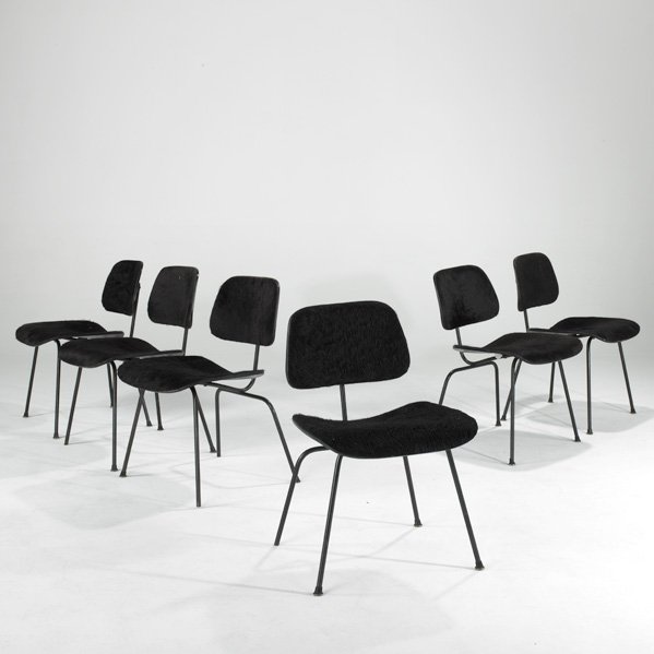 CHARLES AND RAY EAMES; HERMAN MILLER: Set of six DCM, Zeeland, MI; Hide,ebonized plywood,steel and rubber; Branded; Each; 29" x 19 1/2" x 22"