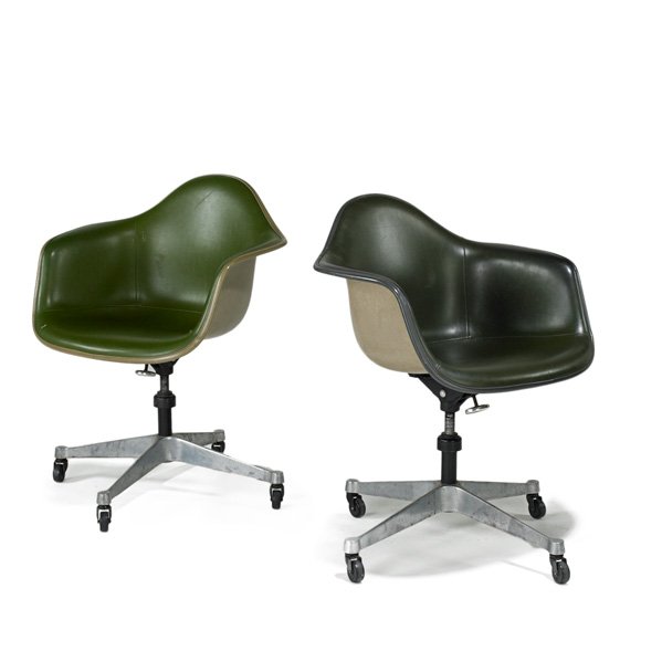 CHARLES AND RAY EAMES; HERMAN MILLER: Pair of swivel armchairs, Zeeland, MI, 1980s; Fiberglass, vinyl and aluminum; Paper label; Each: 33" x 25" x 24"