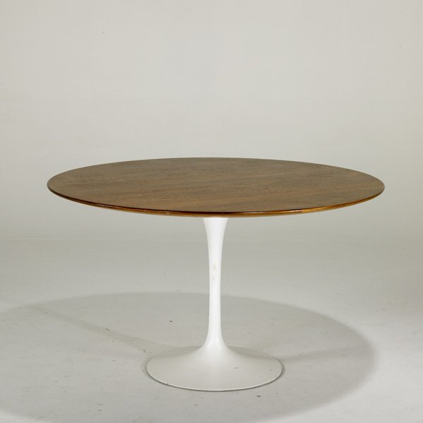 EERO SAARINEN; KNOLL INTERNATIONAL: Tulip dining table, USA, 1960s; Walnut and enameled cast-iron; Unmarked; 28" x 48" dia.