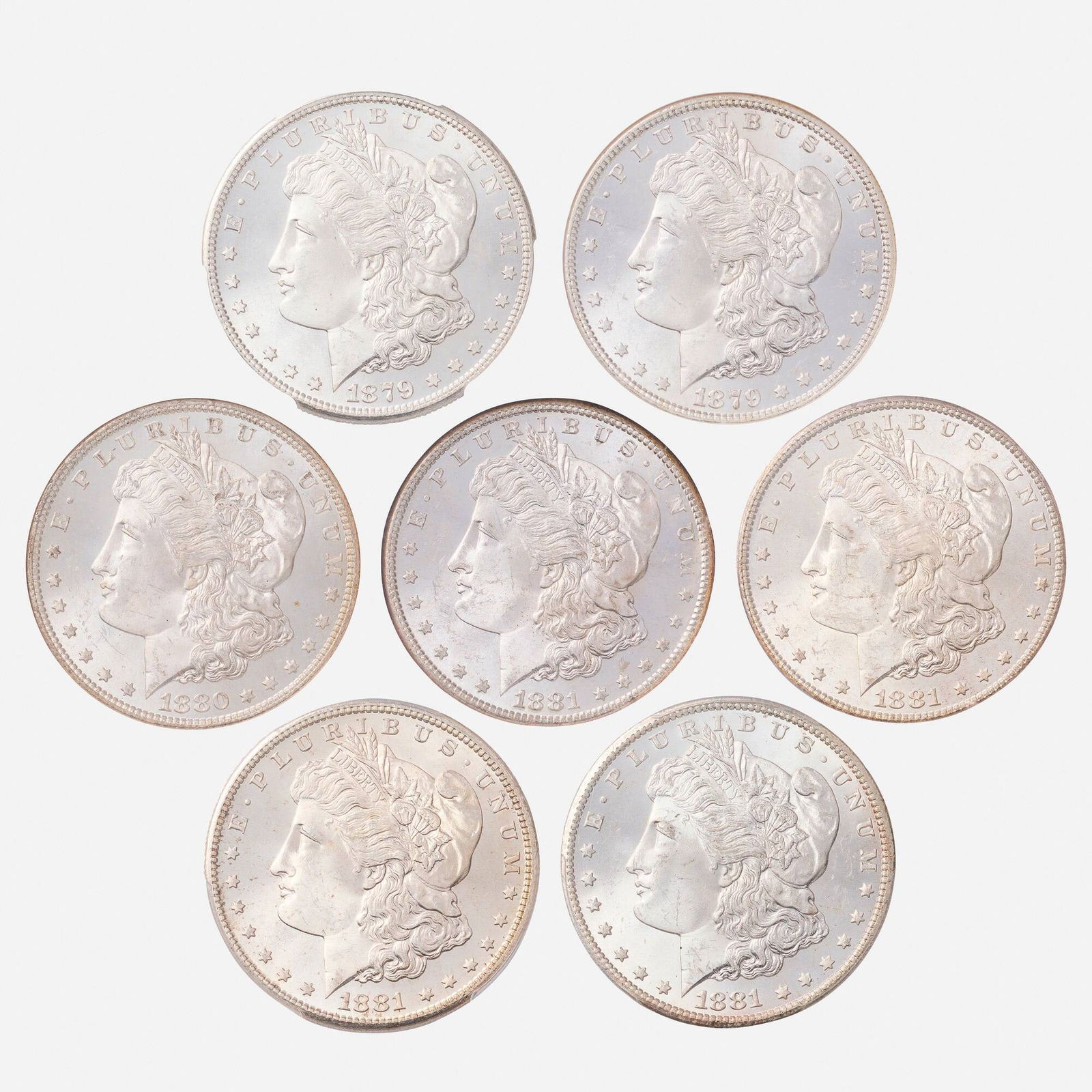 Seven U.S. Graded Morgan $1 Silver Coins (1 of 2)