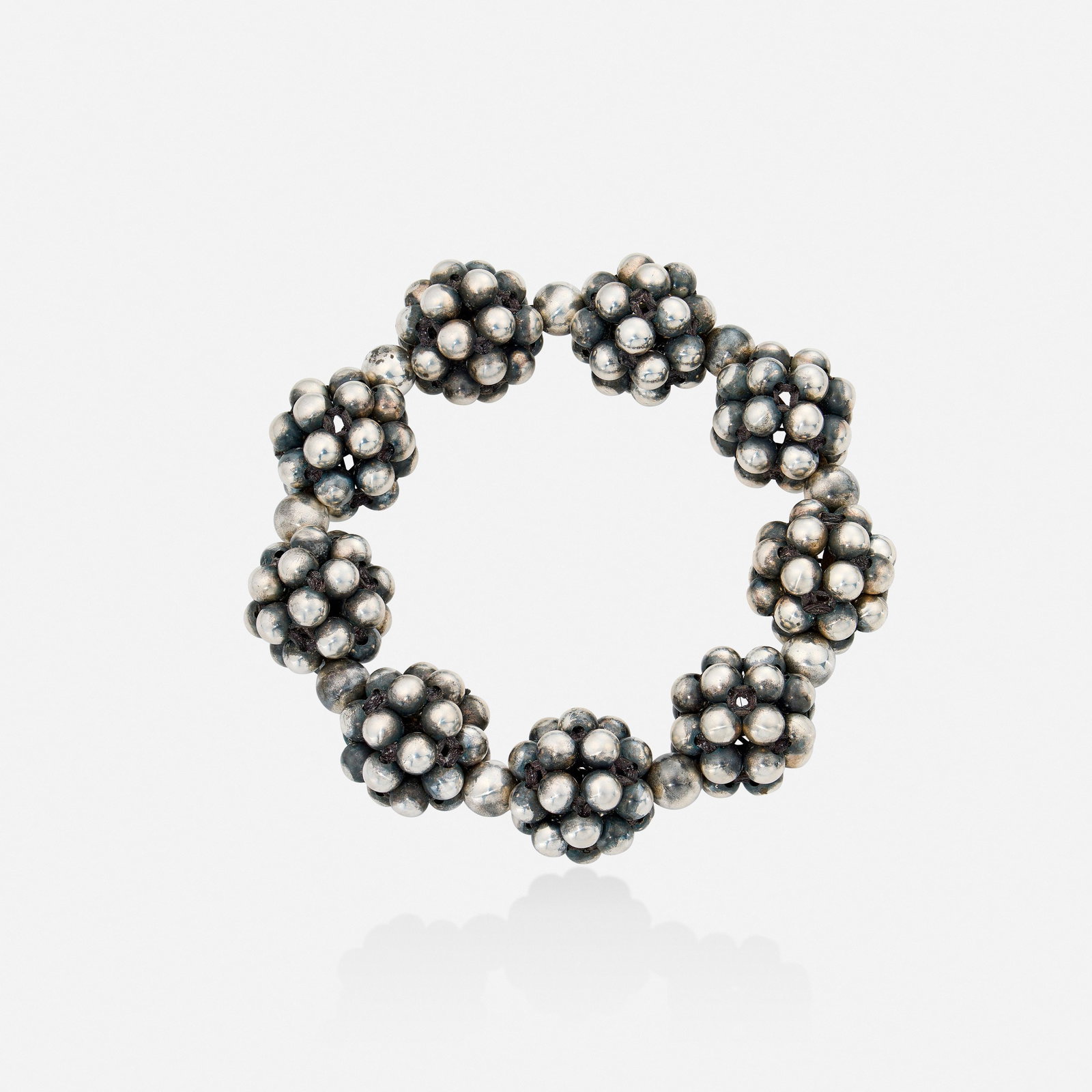 Valerie Hector, Silver bracelet: Valerie Hector Silver bracelet Designed with woven silver beads Silver Inner circ. approx. 7 in, width 0.75 in; Gross weight 34.0 dwts Provenance: Acquired directly from the artist