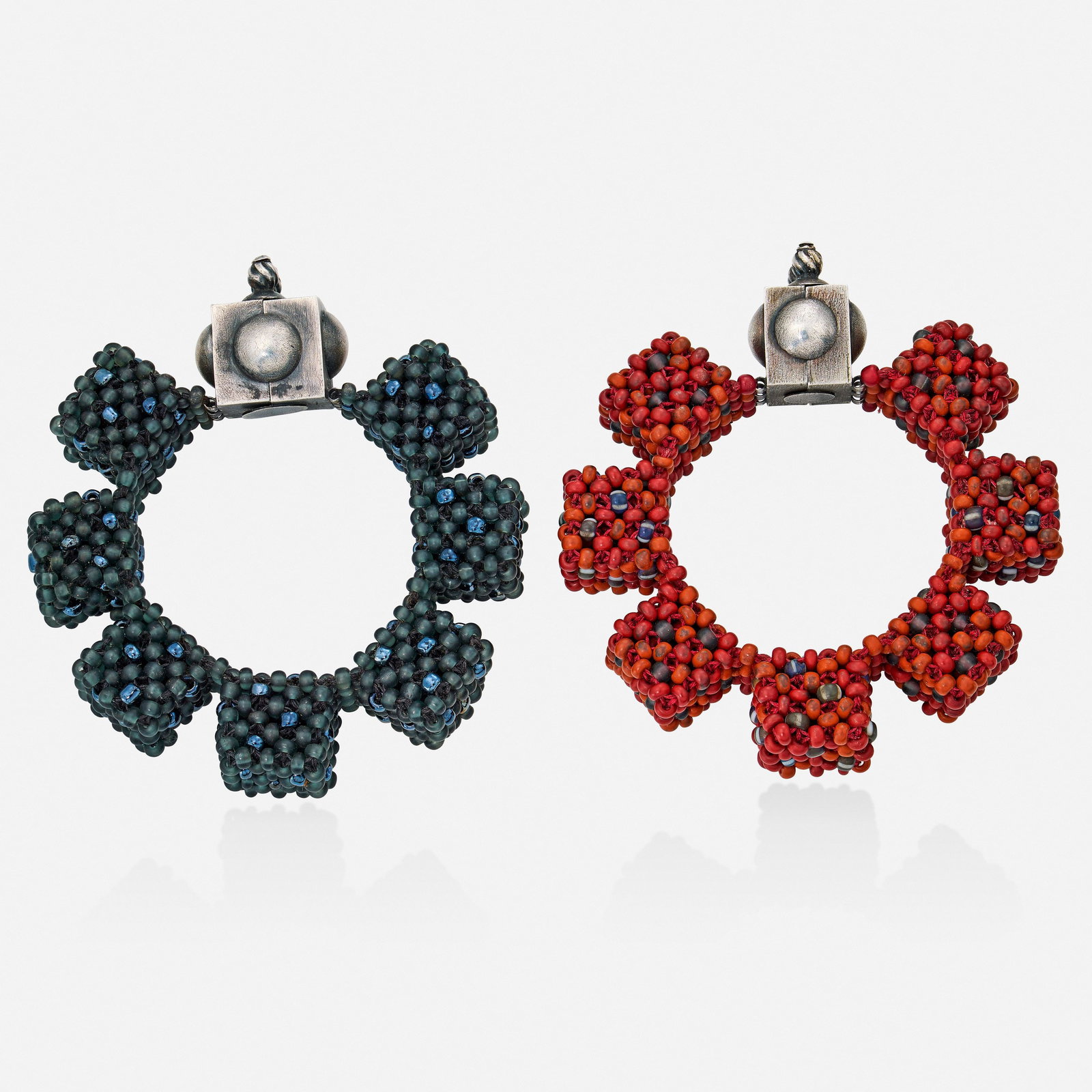 Valerie Hector, Two glass and silver bracelets: Valerie Hector Two glass and silver bracelets Each designed with woven glass beads Silver and base metal 7.25 x 0.75 in and 7.50 x 0.75 in; Gross weight 120.6 dwts Provenance: Acqui