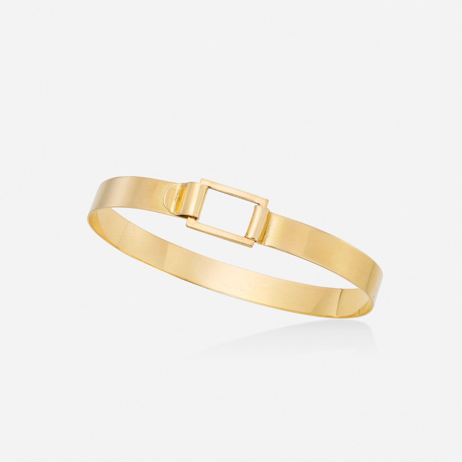 Gold bangle bracelet: Gold bangle bracelet Designed with a hook clasp 14k yellow gold Inner circ. 6.50 in, width 0.25 in; Gross weight 4.9 dwts This work will ship from Lambertville, New Jersey. Condition<