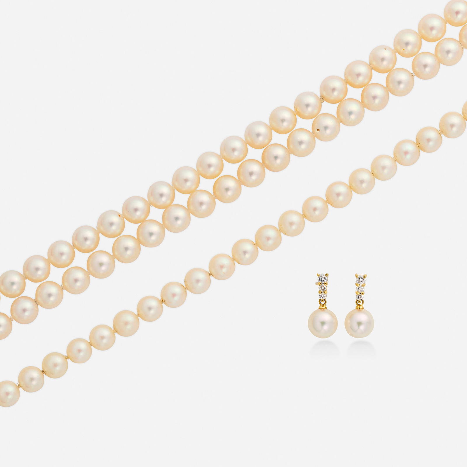 Mikimoto, Group of cultured pearl and gold jewelry: Mikimoto Group of cultured pearl and gold jewelry Comprising a dual strand cultured pearl necklace, a single strand cultured pearl necklace, and a pair of earrings set with graduated round brilliant-c