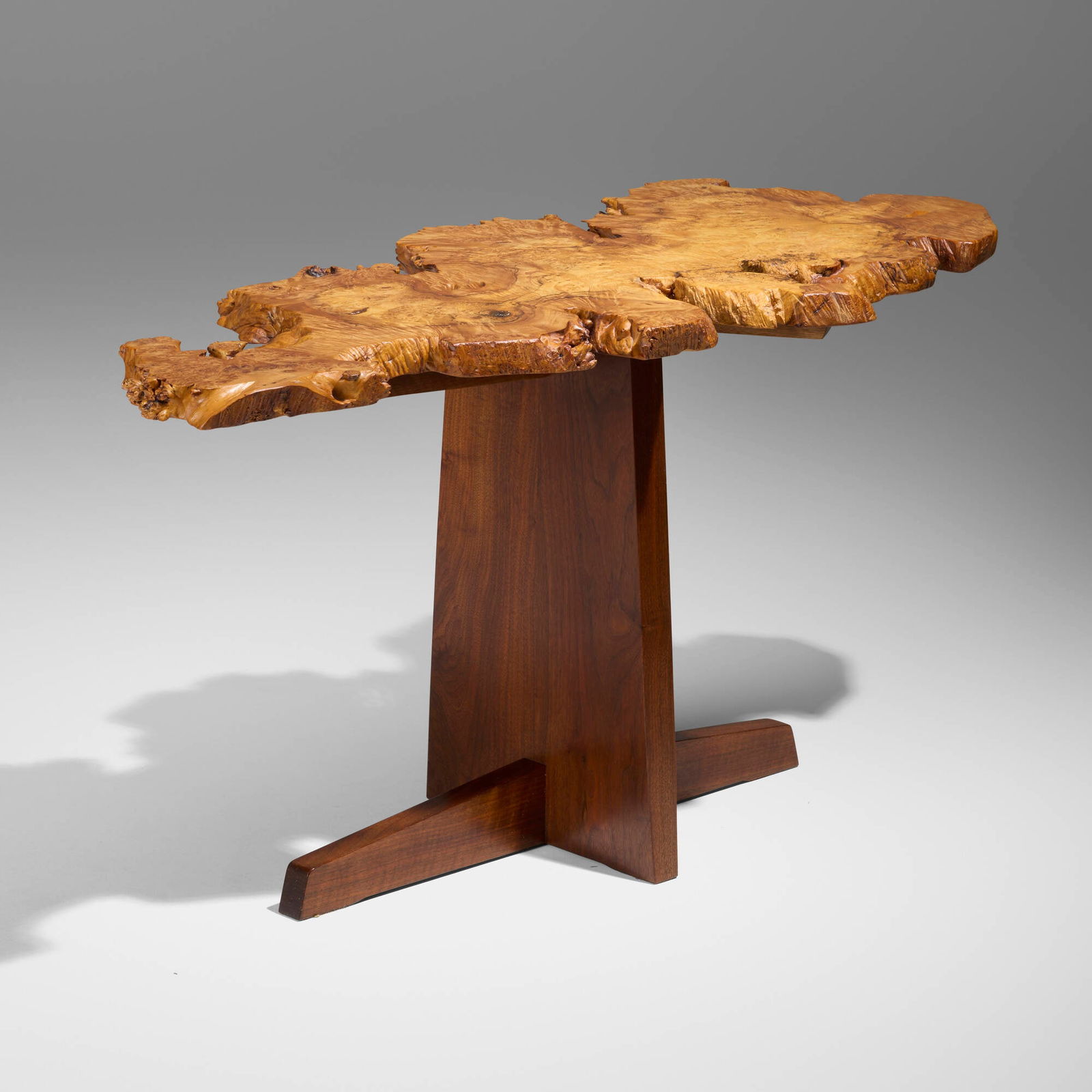 Mira Nakashima, Steinbaum console table: Mira Nakashima Steinbaum console table Nakashima StudioUSA, 2005spalted maple burl, American black walnut 27 h x 52 w x 23 d in (69 x 132 x 58 cm) Table features a single slab burl top w
