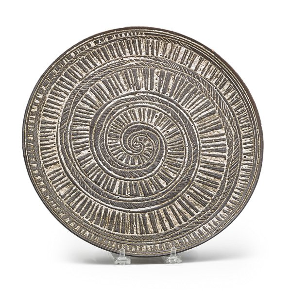 NANCY WICKHAM BOYD Stoneware plate: NANCY WICKHAM BOYD (b. 1923) Stoneware plate incised with spiral decoration; Incised WICKHAM; 10 3/4" dia. Note: Boyd studied at the New York State College of Ceramics at Alfred University in Alfred, 